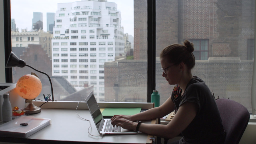 Woman sitting at laptop